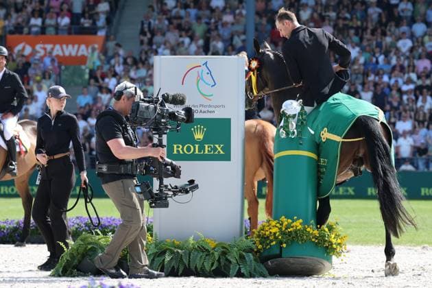Winner, 1 place, Richard Vogel GER with horse United Touch S, Rolex Grand Slam of Show Jumping, Award ceremony, On the way to the Grand Slam, United Touch S and Richi lift the trophy from the pedestal, Funny Moment, Jumping competition with two rounds and jump-off, World Equestrian Festival, World Equestrian Festival, TSCHIO Aachen 2026, TSCHIO instead of CHIO 2026, Aachener Soers, 22 to 24 May 2026, Equestrian sport, 24 05 2026, Aachen Aachener Soers Germany