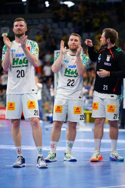 Philipp Weber 20 and Lukas Mertens 22 of SC Magdeburg applaud the spectators after the match in the SAP Arena Next to them is Albin Lagergren 21 also in the white Magdeburg jersey Philipp Weber 20 and Lukas Mertens 22 SC Magdeburg applaud the fans Copyright: xspeedshotx