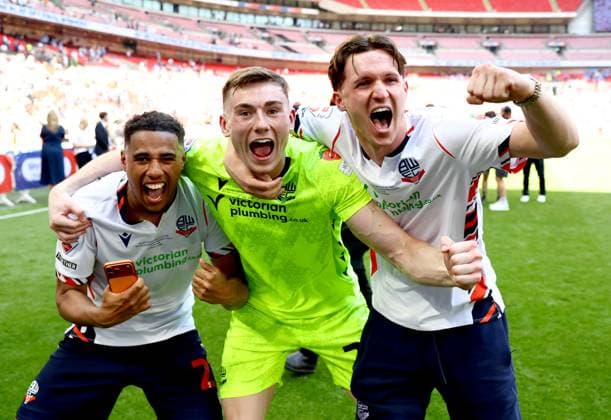 (Left to right) Ethan Erhahon, David Harrington and Johnny Kenny of Bolton Wanderers celebrate after winning the Sky Bet EFL League One Play-off Final and promotion to the Sky Bet EFL Championship Bolton Wanderers v Stockport County, EFL Sky Bet League One, Play-Off Final, Football, Wembley Stadium, London, UK - 24 May 2026London Wembley Stadium United Kingdom EDITORIAL USE ONLY No use with unauthorised audio, video, data, fixture lists, club league logos or live services. Online in-match use limited to 120 images, no video emulation. No use in betting, games or single club league player publications.  Copyright: xSimonxDael Shutterstockx 16889811gz