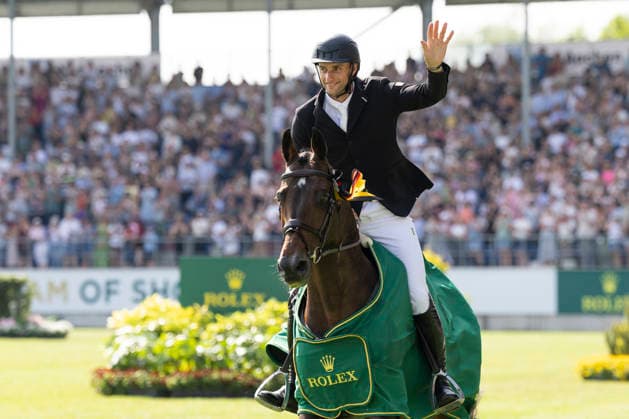 Richard VOGEL GER on United Touch S is happy with his horse about the victory, waving, joy, laughter, cheering, praise, on the lap of honor, Jumping S6 ROLEX Grand Prix, Part of the ROLEX Grand Slam of Show Jumping, The Grand Prix of Aachen, Jumping competition with two rounds and jump-off, CSI5, on 24 05 2026, World Equestrian Festival, TSCHIO Aachen 2026 from 22 24 05 2026 in Aachen Germany Â