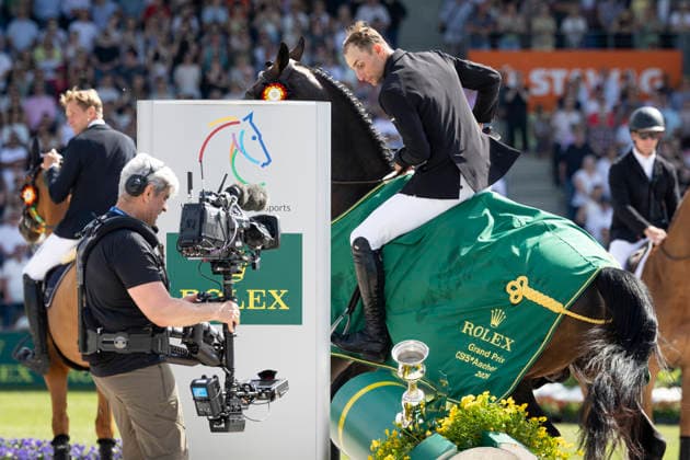 Richard VOGEL GER on United Touch S, lifts the Rolex trophy, action, at the award ceremony, Jumping S6 ROLEX Grand Prix, Part of the ROLEX Grand Slam of Show Jumping, The Grand Prix of Aachen, Jumping competition with two rounds and jump-off, CSI5, on 24 05 2026, World Equestrian Festival, TSCHIO Aachen 2026 from 22 24 05 2026 in Aachen Germany Â