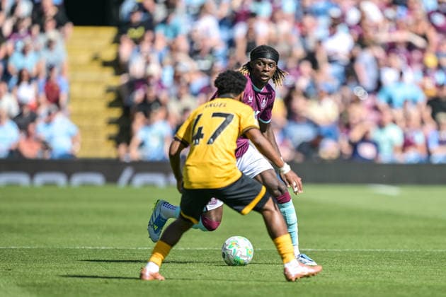 24th May 2026; Turf Moor, Burnley, Lancashire, England; Premier League Football, Burnley versus Wolverhampton Wanderers; Lesley Ugochukwu of Burnley prepares to take on Angel Gomes of Wolverhampton Wanderers with the ball LeexDurkin