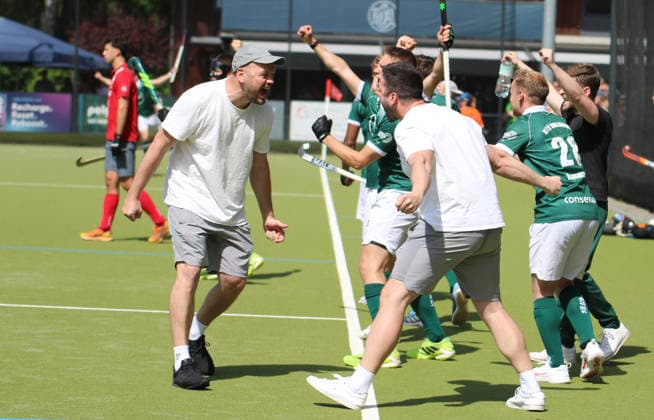 Mens Field Hockey Bundesliga HTCU coach Thilo Stralkowski celebrates the 5-4 victory in the decisive third quarter-final match at the Club an der Alster with an assistant after the final whistle