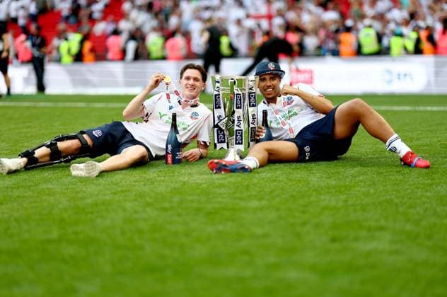 Charlie Warren and Ethan Erhahon of Bolton Wanderers celebrate after winning the Sky Bet EFL League One Play-off Final and promotion to the Sky Bet EFL Championship Bolton Wanderers v Stockport County, EFL Sky Bet League One, Play-Off Final, Football, Wembley Stadium, London, UK - 24 May 2026London Wembley Stadium United Kingdom EDITORIAL USE ONLY No use with unauthorised audio, video, data, fixture lists, club league logos or live services. Online in-match use limited to 120 images, no video emulation. No use in betting, games or single club league player publications.  Copyright: xSimonxDael Shutterstockx 16889811ir