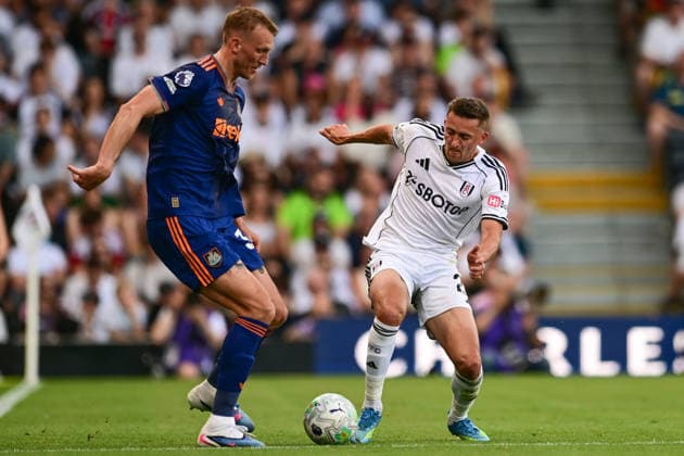 Fulham v Newcastle United, Premier League Fulham defender Timothy Castagne (21) battles for possession with Newcastle United defender Dan Burn (33) during the Premier League match between Fulham and Newcastle United at Craven Cottage, London, UK on 24 May 2026. London Craven Cottage Greater London UK Editorial use only DataCo restrictions apply See www.football-dataco.com , Copyright: xDennisxGoodwinx PSI-24290-0033