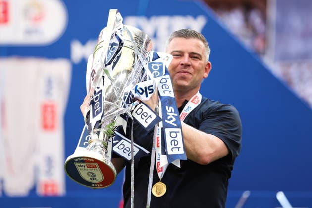 LONDON, ENGLAND - MAY 24: Steven Schumacher, Head Coach of Bolton Wanderers holds the trophy after winning the Sky Bet League One Play-Off Final match between Bolton Wanderers and Stockport County at Wembley Stadium on May 24, 2026 in London, England.  Copyright: xMBxMediax