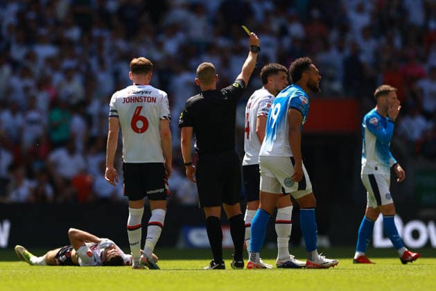 LONDON, ENGLAND - MAY 24: Kyle Wootton of Stockport County is shown a yellow card during the Sky Bet League One Play-Off Final match between Bolton Wanderers and Stockport County at Wembley Stadium on May 24, 2026 in London, England.  Copyright: xMBxMediax