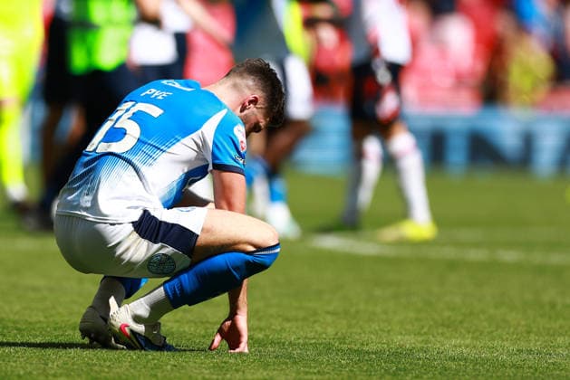 LONDON, ENGLAND - MAY 24: Ethan Pye of Stockport County dejection after the Sky Bet League One Play-Off Final match between Bolton Wanderers and Stockport County at Wembley Stadium on May 24, 2026 in London, England.  Copyright: xMBxMediax