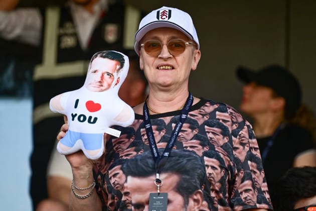 Fulham v Newcastle United, Premier League A lady wearing a Fulham FC hat and a shirt bearing multiple images of Fulham manager Marco Silva holds a doll with a picture of Fulham manager Marco Silva saying I love you during the Premier League match between Fulham and Newcastle United at Craven Cottage, London, UK on 24 May 2026. London Craven Cottage Greater London UK Editorial use only DataCo restrictions apply See www.football-dataco.com , Copyright: xDennisxGoodwinx PSI-24290-0038