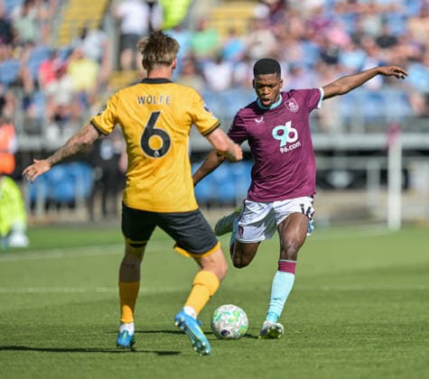 24th May 2026; Turf Moor, Burnley, Lancashire, England; Premier League Football, Burnley versus Wolverhampton Wanderers; Florentino Luis of Burnley crosses the ball while pressured from David Moller Wolfe of Wolverhampton Wanderers LeexDurkin