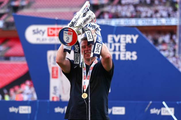 London, England, 24th May 2026. Steven Schumacher manager of Bolton Wanderers lifts the trophy during the Bolton Wanderers vs Stockport County Sky Bet League 1 play off final match at Wembley Stadium, London. Picture credit should read: Jake Youle Sportimage EDITORIAL USE ONLY. No use with unauthorised audio, video, data, fixture lists, club league logos or live services. Online in-match use limited to 120 images, no video emulation. No use in betting, games or single club league player publications. SPI_030_JY_Stockport_County_Bolton_Wanderers SPI-4821-0030
