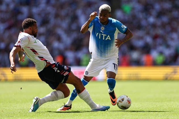 London, England, 24th May 2026. Cyrus Christie of Bolton Wanderers battles with Malik Mothersille of Stockport County during the Bolton Wanderers vs Stockport County Sky Bet League 1 play off final match at Wembley Stadium, London. Picture credit should read: Jake Youle Sportimage EDITORIAL USE ONLY. No use with unauthorised audio, video, data, fixture lists, club league logos or live services. Online in-match use limited to 120 images, no video emulation. No use in betting, games or single club league player publications. SPI_034_JY_Stockport_County_Bolton_Wanderers SPI-4821-0034