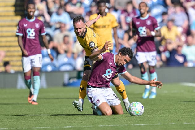 24th May 2026; Turf Moor, Burnley, Lancashire, England; Premier League Football, Burnley versus Wolverhampton Wanderers; Adam Armstrong of Wolverhampton Wanderers brings down Bashir Humphreys of Burnley during a challenge for the ball LeexDurkin