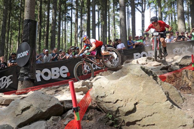 World Cup cross country mountain elite men s race, Vysocina Arena, Nove Mesto na Morave, May 24, 2026. From left, Martin Vidaurre Kossmann of Chile during problems on the downhill of one of the obstacles and Filippo Colombo of Switzerland. (CTKxPhoto LiborxPlihal) CTKPhotoP2026052405457  CTKPhotoP2026052405457
