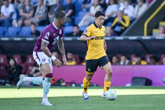 24th May 2026; Turf Moor, Burnley, Lancashire, England; Premier League Football, Burnley versus Wolverhampton Wanderers; Hwang Hee Chan of Wolverhampton Wanderers runs with the ball while Kyle Walker of Burnley moves to intercept him LeexDurkin