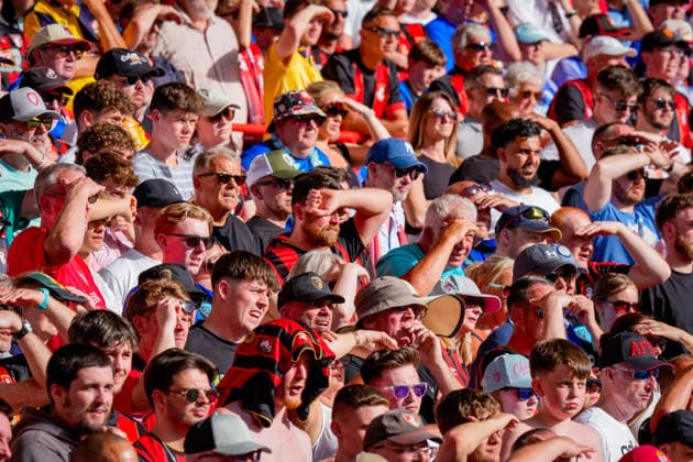 Premier League: Nottingham Forest v Bournemouth Bournemouth fans sheild their eyes from the sun during the Premier League match Nottingham Forest vs Bournemouth at City Ground, Nottingham, United Kingdom on 24 May 2026 (Photo by Maynard Manyowa News Images) Nottingham City Ground Nottinghamshire United Kingdom Copyright: xMaynardxManyowa NewsxImagesx