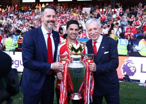 London, England, 24th May 2026. Owners Josh Kroenke ( l) and Stan Kroenke (r) pose with Mikel Arteta manager of Arsenal nd the Premier League Trophy during the Crystal Palace vs Arsenal Premier League match at Selhurst Park, London. Picture credit should read: Paul Terry Sportimage EDITORIAL USE ONLY. No use with unauthorised audio, video, data, fixture lists, club league logos or live services. Online in-match use limited to 120 images, no video emulation. No use in betting, games or single club league player publications. SPI_083_PT_Palace_Arsenal SPI-4818-0083