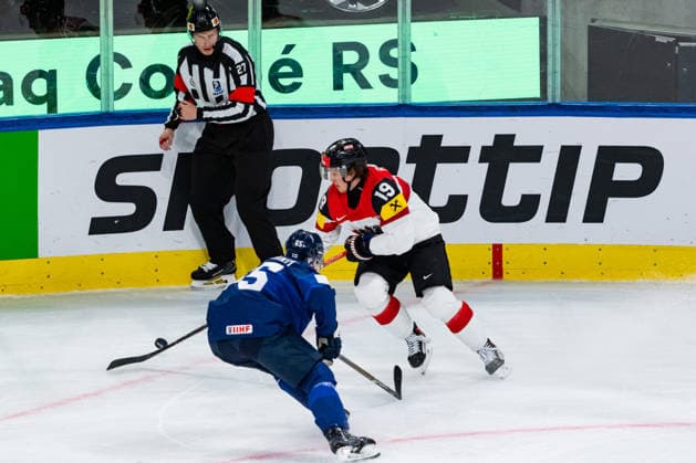 ZURICH, SWITZERLAND - MAY 24: Vinzenz Rohrer (Austria, 19) in the battle for the puck withSakari Manninen (Finland, 65) during the Preliminary Round - Group A Match 45 between Finland and Austria at the IIHF Ice hockey, Eishockey World Championship, WM, Weltmeisterschaft 2026, Swiss Life Arena on May 24, 2026 in Zurich, Switzerland. Zurich Switzerland Copyright: xTimoxSteinx