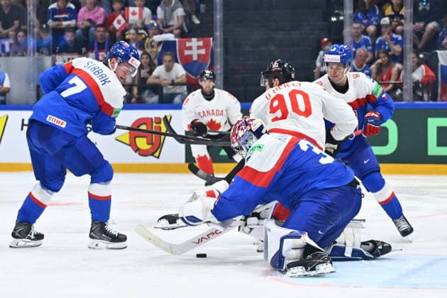 L-R Maxim Strbak (SVK), goalkeeper Samuel Hlavaj (SVK) and Ryan O Reilly (CAN) in action during to the group B match of the World Ice hockey, Eishockey Championship, Slovakia - Canada, Fribourg, Switzerland, on May 24, 2026. (CTKxPhoto RadekxPetrasek) CTKPhotoP2026052406692  CTKPhotoP2026052406692