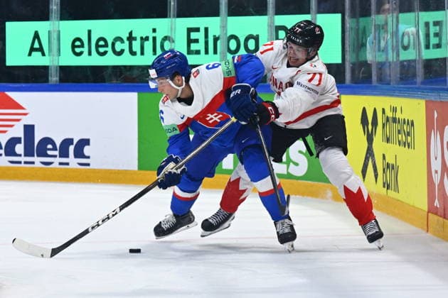 L-R Viliam Kmec (SVK) and Macklin Celebrini (CAN) in action during to the group B match of the World Ice hockey, Eishockey Championship, Slovakia - Canada, Fribourg, Switzerland, on May 24, 2026. (CTKxPhoto RadekxPetrasek) CTKPhotoP2026052406764  CTKPhotoP2026052406764