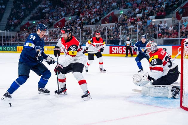 ZURICH, SWITZERLAND - MAY 24: Aatu Raety (Finland, 34) against Bernd Wolf (Austria, 32) in front of Davis Kickert (Austria, 30) during the Preliminary Round - Group A Match 45 between Finland and Austria at the IIHF Ice hockey, Eishockey World Championship, WM, Weltmeisterschaft 2026, Swiss Life Arena on May 24, 2026 in Zurich, Switzerland. Zurich Switzerland Copyright: xTimoxSteinx