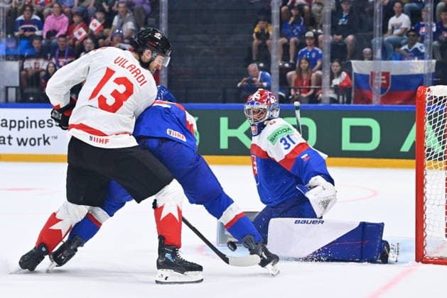 L-R Gabriel Vilardi (CAN), Viliam Kmec (SVK) and goalkeeper Samuel Hlavaj in action during to the group B match of the World Ice hockey, Eishockey Championship, Slovakia - Canada, Fribourg, Switzerland, on May 24, 2026. (CTKxPhoto RadekxPetrasek) CTKPhotoP2026052406890  CTKPhotoP2026052406890