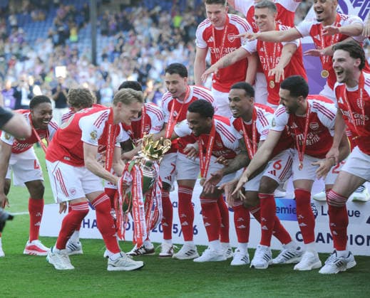 Football - 2025 2026 Premier League - Crystal Palace vs. Arsenal - Selhurst Park - Sunday 24th May 2026 Martin Odegaard of Arsenal brings the Premier League trophy over to the team 
