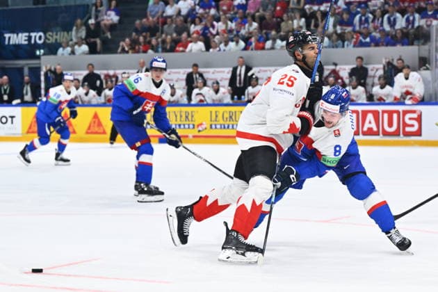 L-R Darnell Nurse (CAN) and Oliver Okuliar (SVK) in action during to the group B match of the World Ice hockey, Eishockey Championship, Slovakia - Canada, Fribourg, Switzerland, on May 24, 2026. (CTKxPhoto RadekxPetrasek) CTKPhotoP2026052407088  CTKPhotoP2026052407088