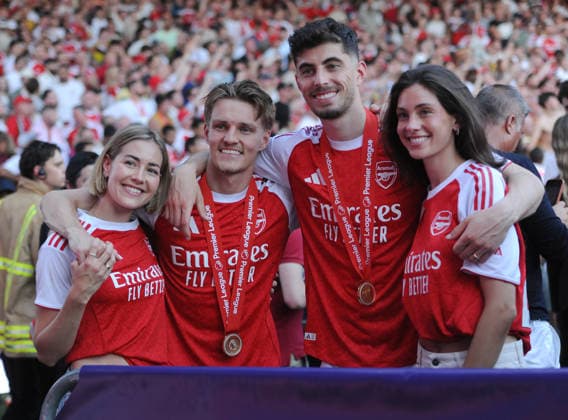 Football - 2025 2026 Premier League - Crystal Palace vs. Arsenal - Selhurst Park - Sunday 24th May 2026 Martin Odegaard of Arsenal with wife Helene Spilling and Kai Havertz with wife, Sophia Weber with their winners medals 