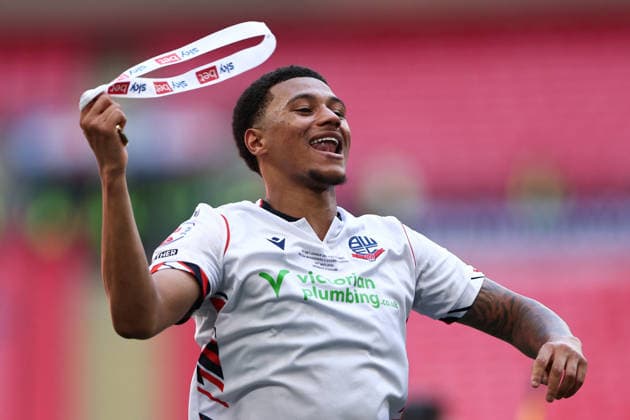 London, England, 24th May 2026. Mason Burstow of Bolton Wanderers waves his medal around to celebrate victory during the Bolton Wanderers vs Stockport County Sky Bet League 1 play off final match at Wembley Stadium, London. Picture credit should read: Jake Youle Sportimage EDITORIAL USE ONLY. No use with unauthorised audio, video, data, fixture lists, club league logos or live services. Online in-match use limited to 120 images, no video emulation. No use in betting, games or single club league player publications. SPI_090_JY_Stockport_County_Bolton_Wanderers SPI-4821-0090