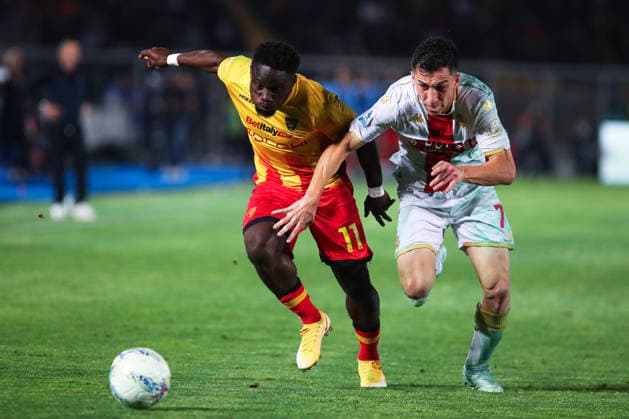 Konan N Dri of US Lecce and Patrizio Masini of Genoa CFC compete for the ball during the serie A match between US Lecce and Genoa CFC at Ettore Giardiniero - Via del Mare stadium in Lecce (Italy), May 24, 2026. massimilianoxcarnabuci