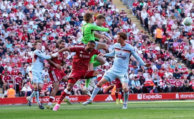 Liverpool s Cody Gakpo battles with Brentford s Caoimhin Kelleher and Nathan Collins Liverpool v Brentford, Premier League, Football, Anfield, Liverpool, UK - 24 May 2026Liverpool Anfield United Kingdom EDITORIAL USE ONLY No use with unauthorised audio, video, data, fixture lists, club league logos or live services. Online in-match use limited to 120 images, no video emulation. No use in betting, games or single club league player publications.  Copyright: xAlexxDodd Shutterstockx 16889846cj