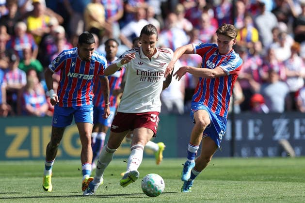 24th May 2026; Selhurst Park, Selhurst, London, England; Premier League Football, Crystal Palace versus Arsenal; Riccardo Calafiori of Arsenal and Justin Devenny of Crystal Palace compete for the ball with Daniel Munoz of Crystal Palace following KatiexChan