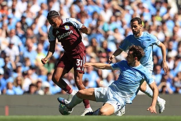 24th May 2026; Etihad Stadium, Manchester, Lancashire, England; Premier League Football, Manchester City versus Aston Villa; Nico Gonzales of Manchester City slides in to tackle Leon Bailey of Aston Villa DavidxBlunsden