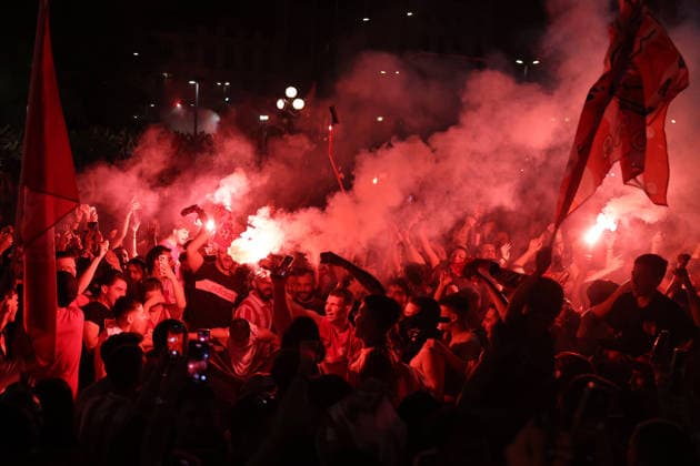 Olympiacos fans celebrate EuroLeague title in Piraeus PIRAEUS, GREECE - MAY 25: Olympiacos fans celebrate their team’s EuroLeague victory outside the Municipal Theatre in Piraeus, Greece on May 25, 2026. The Greek side claimed its fourth EuroLeague title after defeating Real Madrid 92-85 in the championship game of the Final Four held in Athens, ending a 13-year wait for the trophy. Costas Baltas Anadolu Piraeus Greece. Editorial use only. Please get in touch for any other usage.  Copyright: x2026xAnadoluxCostasxBaltasx