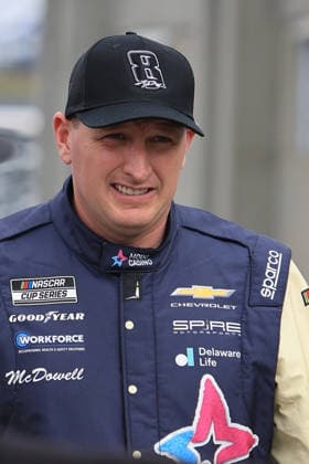 CHARLOTTE, NC - MAY 24: Michael McDowell ( 71 Spire Motorsports Modo Casino Chevrolet) walks in the garage area wearing a Hat honoring the late Kyle Busch prior to the running of the NASCAR, Motorsport, USA Cup Series Coca-Cola 600 on May 24, 2026 at Charlotte Motor Speedway in Charlotte, NC. (Photo by Jeff Robinson Icon Sportswire) AUTO: MAY 24 NASCAR Cup Series Coca-Cola 600 EDITORIAL USE ONLY Icon2605245889600