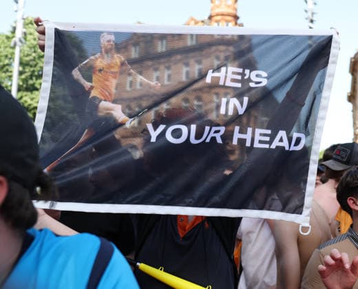 Hull Bus Parade A Hull City fan holds an Oli McBurnie of Hull City He™s in your Head banner on the parade route during the Hull City Bus Parade on the streets of Hull, England after being promoted to the Premier League in the Sky Bet Championship Play-Off Final on Saturday 23rd May 2026. 25 05 2026 UK Newspapers OUT Copyright: xAndyxSumnerx FIL-23472-0081