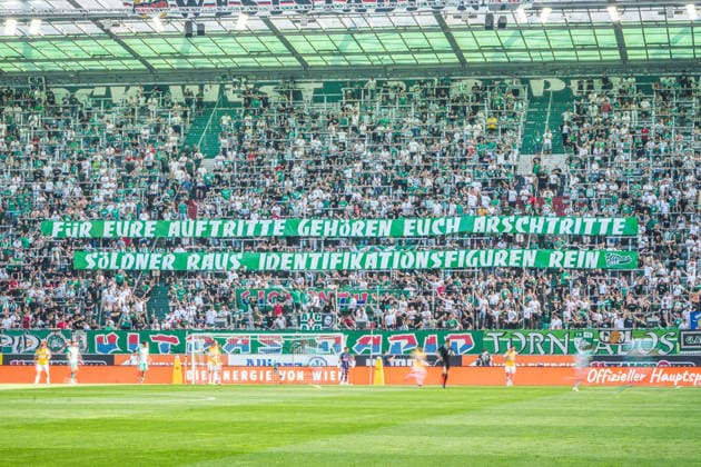 Football Austria, Admiral Bundesliga European Cup Playoff Final ECL 2025 2026, SK Rapid Wien vs SV Oberbank Ried Allianz Stadium Weststadion, Vienna Hütteldorf Banner of the Ultras Rapid with the lettering For your performances you deserve ass-kickings Mercenaries out, identification figures in Copyright: xLukasxBierederx