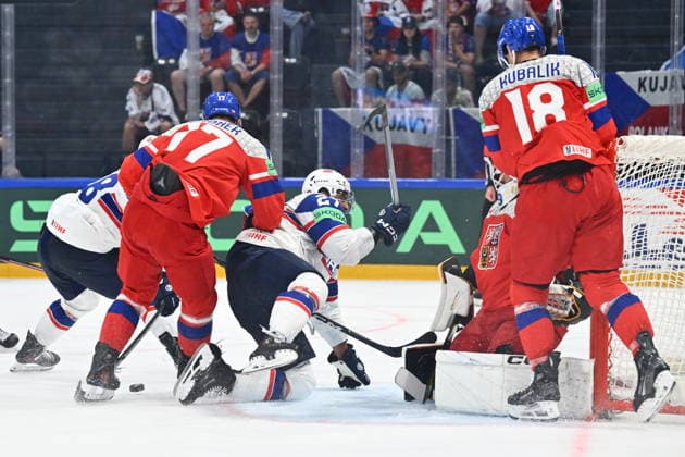Andreas Martinsen of Norway, 3rd left, and goalkeeper Dominik Pavlat of Czech Republic, 2nd right, in action during the IIHF World Championship, WM, Weltmeisterschaft Group B match Czech Republic vs Norway on May 25, 2026, Fribourg, Switzerland. (CTKxPhoto RadekxPetrasek) CTKPhotoP2026052505735  CTKPhotoP2026052505735
