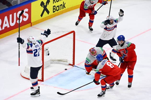 Martin Ronnild of Norway, left, celebrates a goal during the IIHF World Championship, WM, Weltmeisterschaft Group B match Czech Republic vs Norway on May 25, 2026, Fribourg, Switzerland. At center is goalkeeper Dominik Pavlat of Czech Republic. (CTKxPhoto RadekxPetrasek) CTKPhotoP2026052506110  CTKPhotoP2026052506110