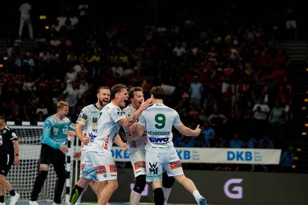 Ludvig Jurmala Åström and his Göppingen teammates cheer after a goal in the Barclays Arena The circle player is the center of a celebration scene with several players in white jerseys during the Bundesliga match against Hamburg Handball Sport Verein Hamburg vs Frisch Auf Göppingen Copyright: xPhilippHeistx