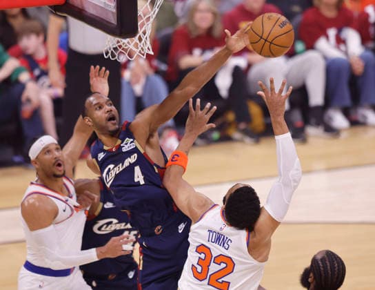 Cleveland Cavaliers Evan Mobley (4) blocks the shot of New York Knicks Karl-Anthony Towns (32) in the first quarter of the Eastern Conference Final game 4 in Cleveland, Ohio Monday May 25, 2026.  CLE20260525104 AARONxJOSEFCZYK