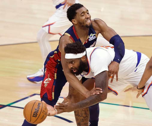 Cleveland Cavaliers Donovan Mitchell (45) defends New York Knicks Mitchell Robinson in the second quarter of the Eastern Conference Final game 4 in Cleveland, Ohio Monday May 25, 2026.  CLE20260525111 AARONxJOSEFCZYK