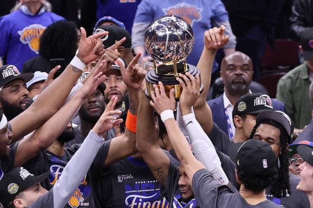 The New York Knicks celebrate a 130-93 win over the Cleveland Cavaliers in the Eastern Conference Final game 4 to win the series 4-0 in Cleveland, Ohio Monday May 25, 2026.  CLE20260525114 AARONxJOSEFCZYK