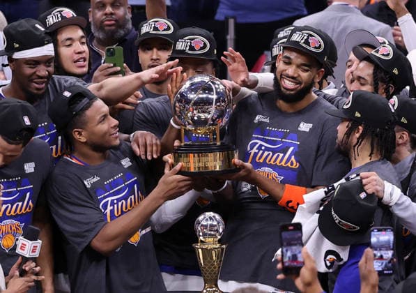 The New York Knicks celebrate a 130-93 win over the Cleveland Cavaliers in the Eastern Conference Final game 4 to win the series 4-0 in Cleveland, Ohio Monday May 25, 2026.  CLE20260525118 AARONxJOSEFCZYK