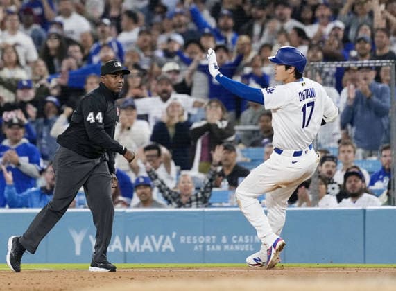 Baseball: Rockies vs. Dodgers Los Angeles Dodgers designated hitter Shohei Ohtani challenges the first base umpire s out call after he was judged to have grounded into a double play with no out and bases loaded in the seventh inning of a baseball game against the Colorado Rockies at Dodger Stadium in Los Angeles on May 25, 2026. The decision was overturned.  A14AA0005611876P