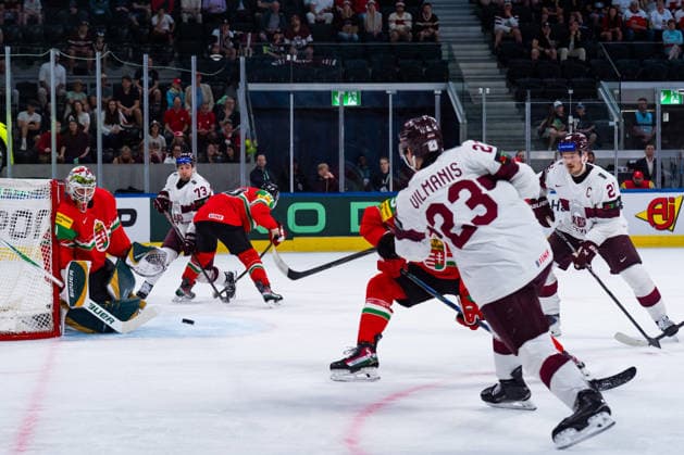 ZURICH, SWITZERLAND - MAY 26: Sandis Vilmanis (Latvia, 23) -shooting at Bence Balizs (Hungary, 1) during the Preliminary Round - Group A Match 51 between Hungary and Latvia at the IIHF Ice hockey, Eishockey World Championship, WM, Weltmeisterschaft 2026, Swiss Life Arena on May 26, 2026 in Zurich, Switzerland. Zurich Switzerland Copyright: xTimoxSteinx