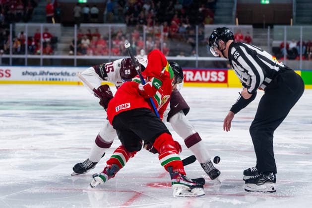 ZURICH, SWITZERLAND - MAY 26: Oskars Batna (Latvia, 95) in the battle for the puck with - during the Preliminary Round - Group A Match 51 between Hungary and Latvia at the IIHF Ice hockey, Eishockey World Championship, WM, Weltmeisterschaft 2026, Swiss Life Arena on May 26, 2026 in Zurich, Switzerland. Zurich Switzerland Copyright: xTimoxSteinx