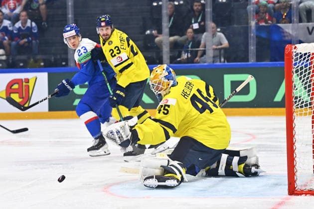 From left Adam Liska of Slovakia, Oliver Ekman-Larsson of Sweden and goalkeeper Magnus Hellberg of Sweden in action during the IIHF World Championship, WM, Weltmeisterschaft Group B match Sweden vs Slovakia on May 26, 2026, Fribourg, Switzerland. (CTKxPhoto RadekxPetrasek) CTKPhotoP2026052606245  CTKPhotoP2026052606245