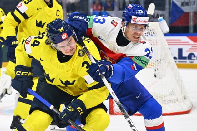 From left Albert Johansson of Sweden and Adam Liska of Slovakia in action during the IIHF World Championship, WM, Weltmeisterschaft Group B match Sweden vs Slovakia on May 26, 2026, Fribourg, Switzerland. (CTKxPhoto RadekxPetrasek) CTKPhotoP2026052606424  CTKPhotoP2026052606424